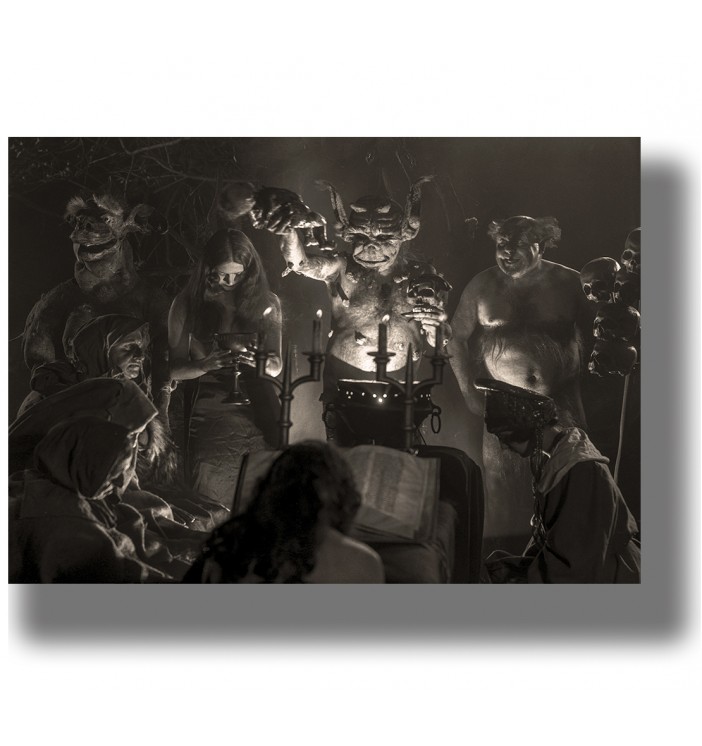 Black and white scene with witches, demons, and candles from the silent film Häxan.