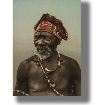 Older South African man wearing a patterned red headwrap and colorful beaded necklaces in a vintage portrait.