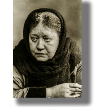 Vintage black and white portrait of Helena Blavatsky wearing a dark headscarf and looking away from the camera.