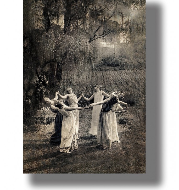 Vintage-style image of women dancing in a circle in a forest clearing.