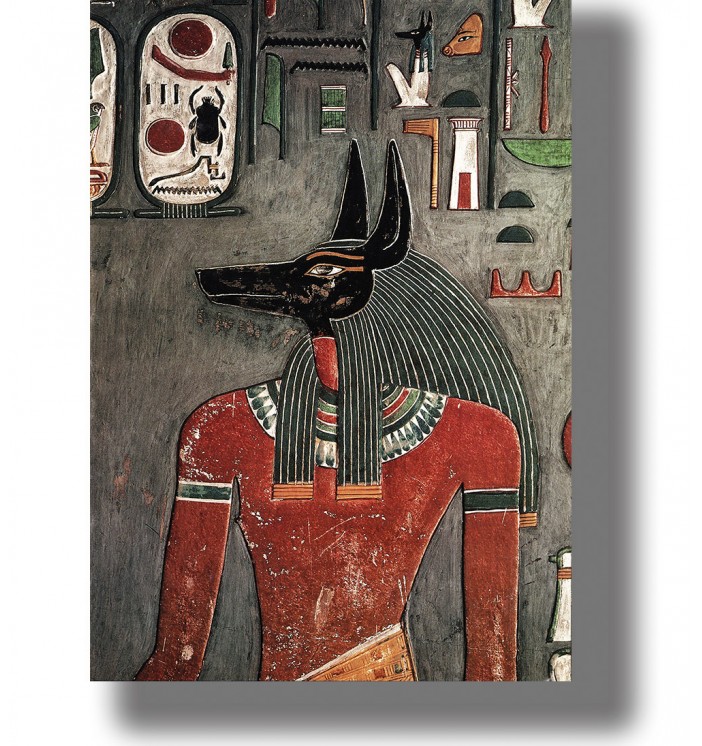 Ancient Egyptian image of Anubis as a man with a black jackal head surrounded by hieroglyphs.