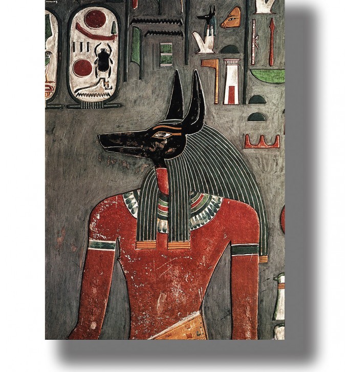 Ancient Egyptian image of Anubis as a man with a black jackal head surrounded by hieroglyphs.