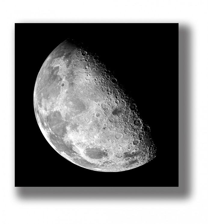 Black and white photograph of the Moon showing its cratered lunar surface against a deep black background.