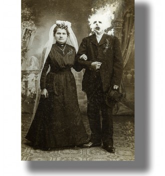 Vintage wedding photo of a bride standing beside a groom whose head appears to be on fire.