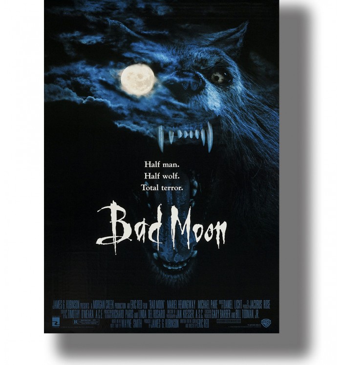 Large snarling werewolf with sharp fangs beside a glowing full moon on a dark vintage movie poster.