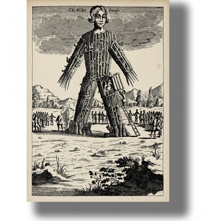 Vintage engraving of a giant wicker man figure with a ladder and people gathered around during a pagan ritual ceremony.