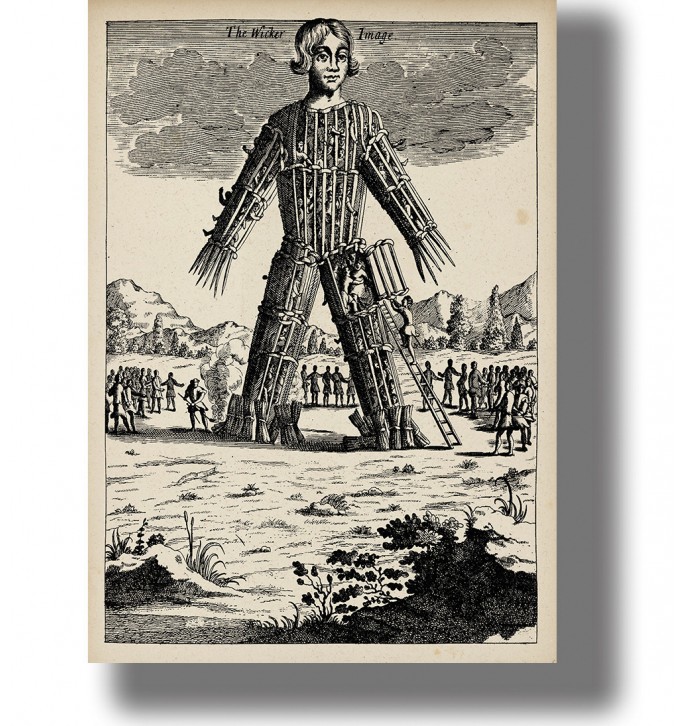Vintage engraving of a giant wicker man figure with a ladder and people gathered around during a pagan ritual ceremony.
