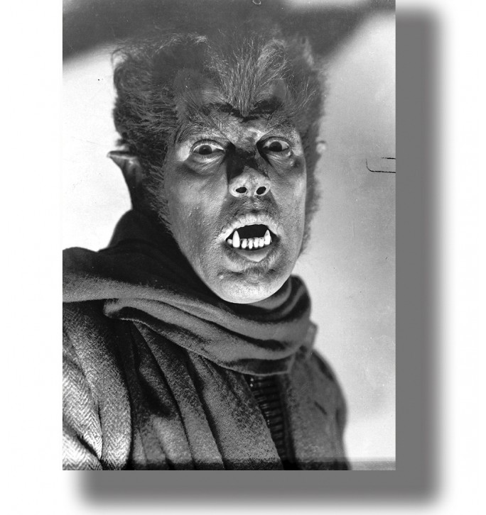 Black and white portrait of a werewolf figure with sharp teeth, pointed ears, and a frightened expression.