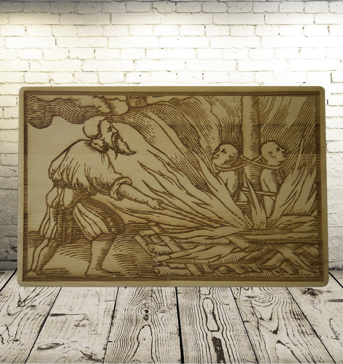 The burning of heretics. An old engraving on a wooden board.